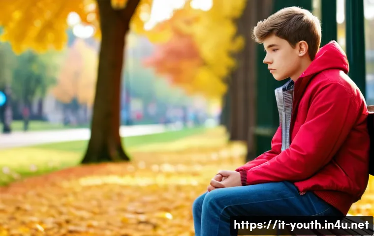 청소년상담사와 청소년 발달심리학의 관계 - A thoughtful teenage boy sitting alone in a peaceful urban park during early autumn, wearing casual ...